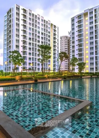 Luxurious high-rise apartments with stunning pool view and lush greenery