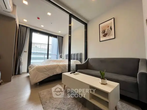 Modern studio apartment with cozy living area and stylish decor