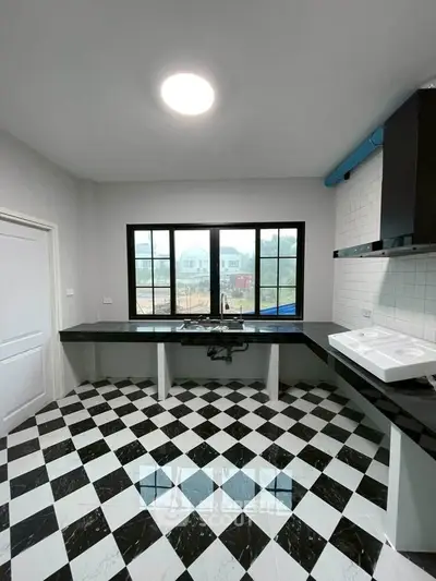 Modern kitchen with checkered floor and large window