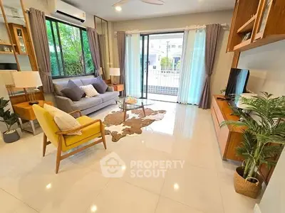 Spacious modern living room with large windows and stylish decor