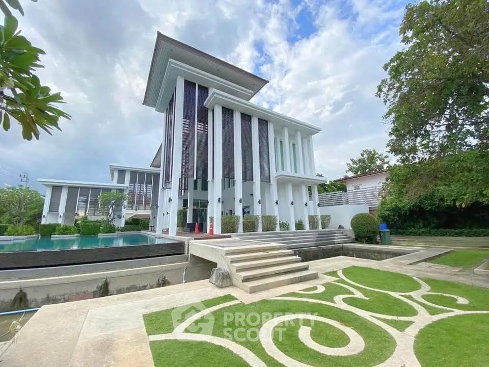 Stunning modern villa with unique architectural design and lush landscaped garden.