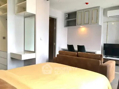 Modern studio apartment with cozy living area and stylish decor