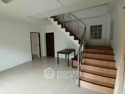 Spacious interior with modern staircase and minimalist design