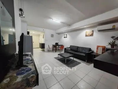 Spacious living room with modern furniture and open layout