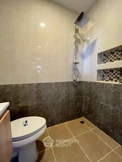 Modern bathroom with sleek shower and stylish tile design