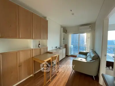 Modern living room with wooden cabinets and city view balcony