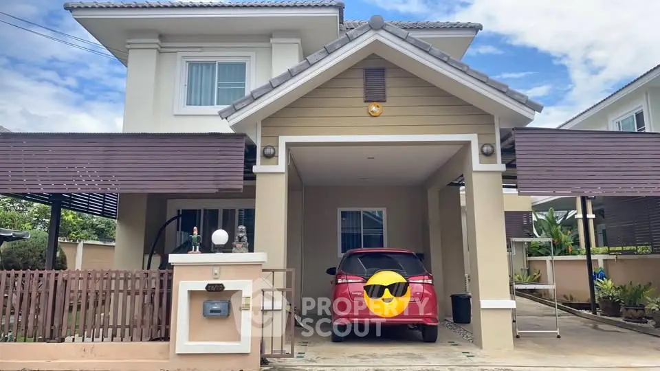 Charming two-story house with carport and modern exterior design.