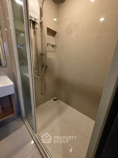 Modern bathroom with sleek shower and elegant fixtures