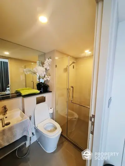 Modern bathroom with glass shower and elegant fixtures