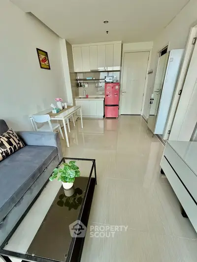 Modern open-plan living room with sleek kitchen and stylish decor