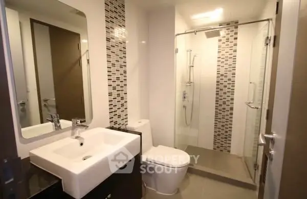 Modern bathroom with sleek design and glass shower enclosure