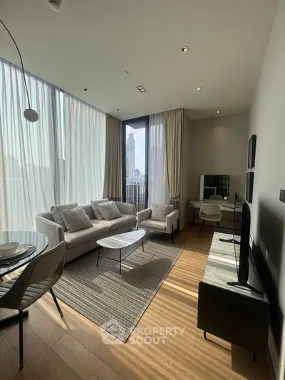 Modern living room with floor-to-ceiling windows and stylish furniture in a high-rise apartment.