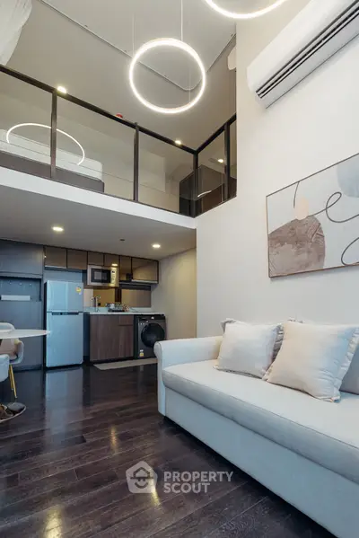 Modern loft apartment with stylish living area and mezzanine bedroom