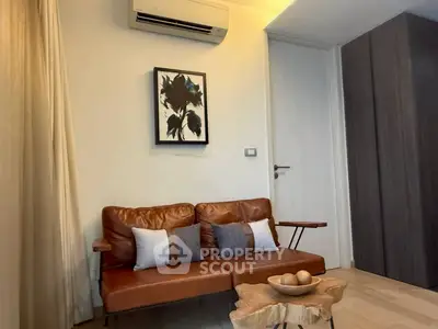 Cozy living room with leather sofa and modern decor