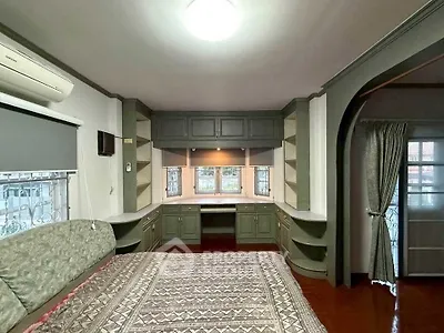 Spacious bedroom with built-in storage and elegant decor