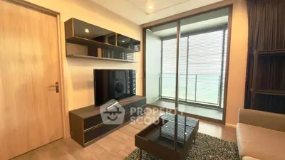 Modern living room with sleek furniture and balcony view, perfect for urban living.
