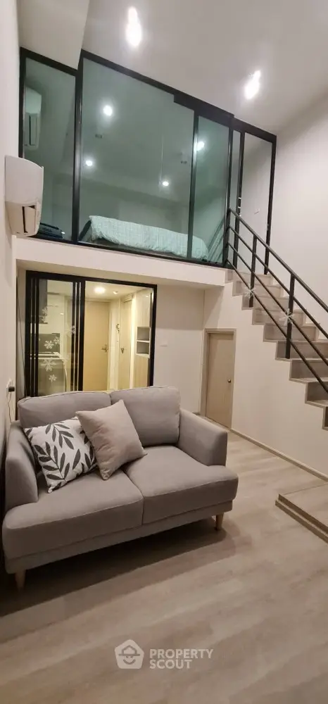 Modern loft apartment with stylish mezzanine bedroom and cozy living area