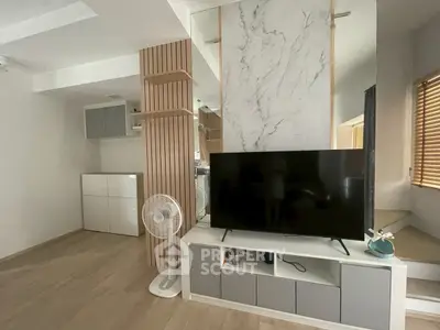 Modern living room with sleek TV setup and stylish decor