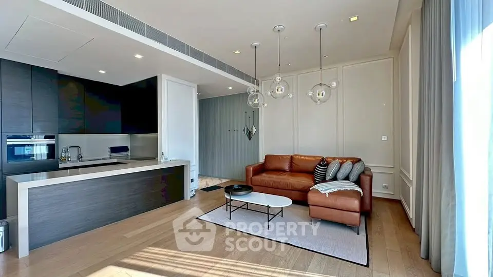 Modern living room with open kitchen and stylish lighting