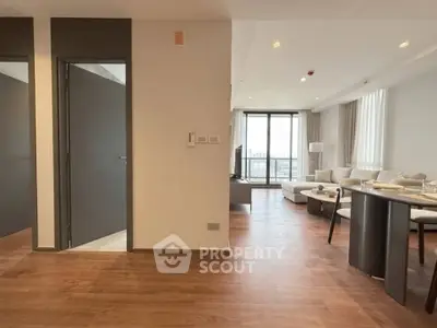 Spacious modern living room with open layout and large windows