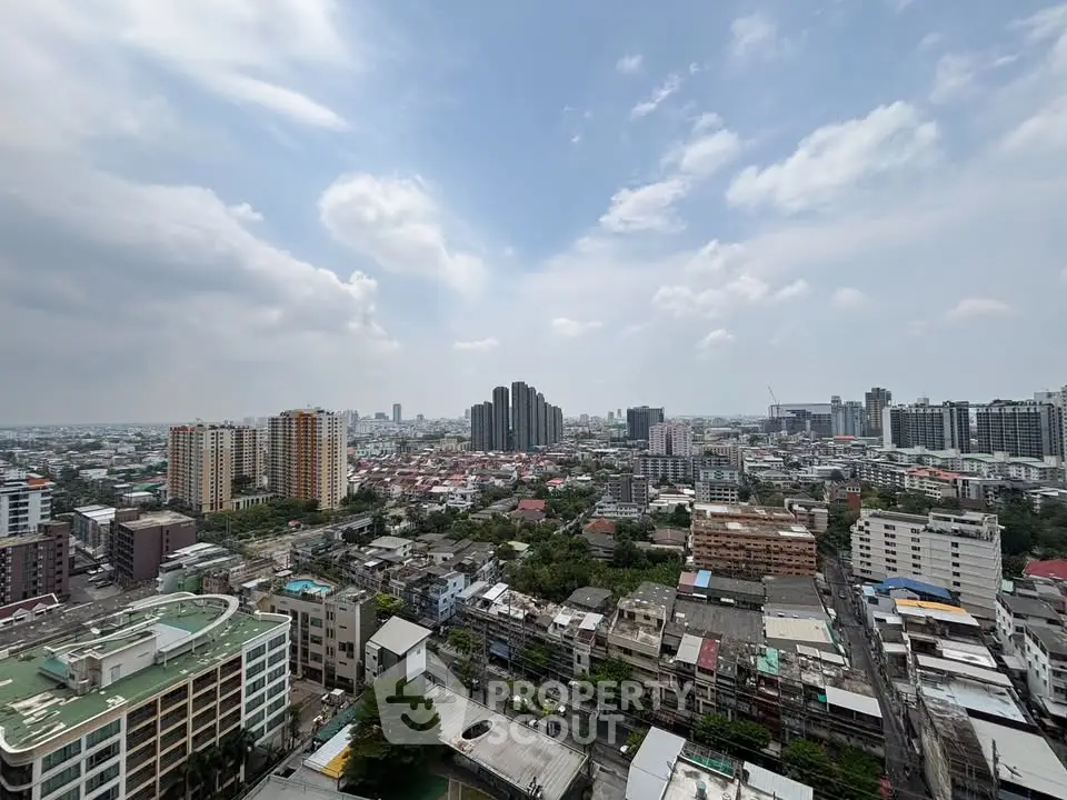 Stunning cityscape view from high-rise building showcasing urban skyline and vibrant city life.