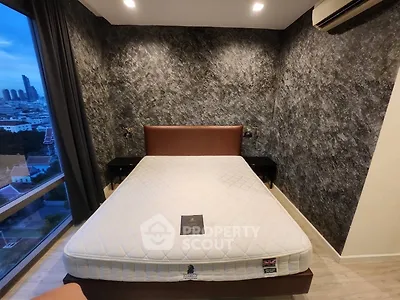 Modern bedroom with stylish textured wall and city view window