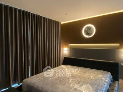 Luxurious bedroom with modern lighting and elegant curtains