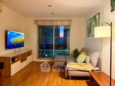 Cozy living room with city view, modern decor, and comfortable seating.