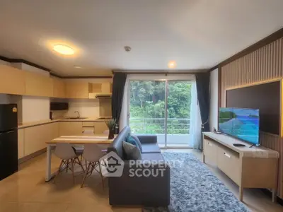 Modern open-layout living room with kitchen and balcony view