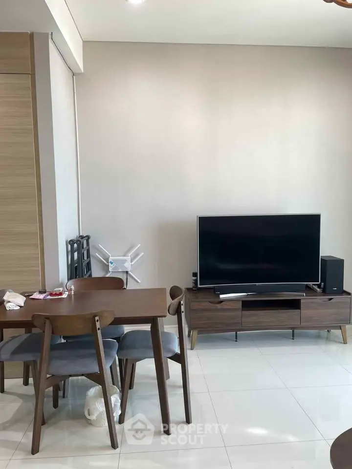 Modern living room with sleek furniture and large TV setup