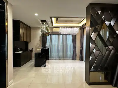 Luxurious modern living room with elegant chandelier and stylish decor