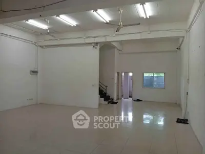 Spacious open-plan interior with high ceilings and natural light, ideal for versatile use.