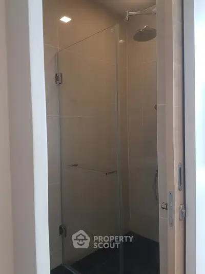 Modern bathroom with glass shower enclosure and sleek design