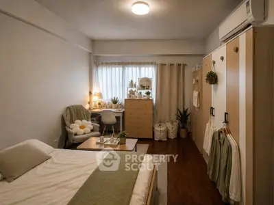 Cozy bedroom with modern decor, featuring a study area and ample storage space.