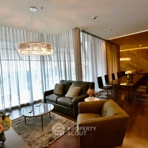 Luxurious living room with elegant chandelier and modern furnishings