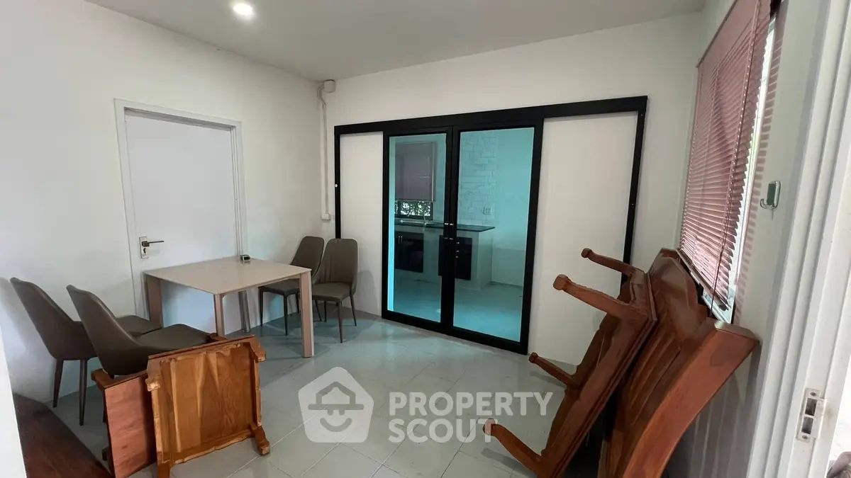 Cozy dining area with modern sliding doors and minimalist furniture