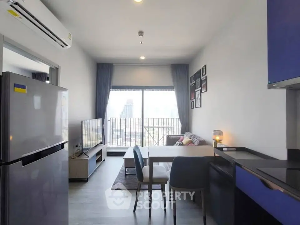 Modern living room with city view, sleek furniture, and open layout in a high-rise apartment.