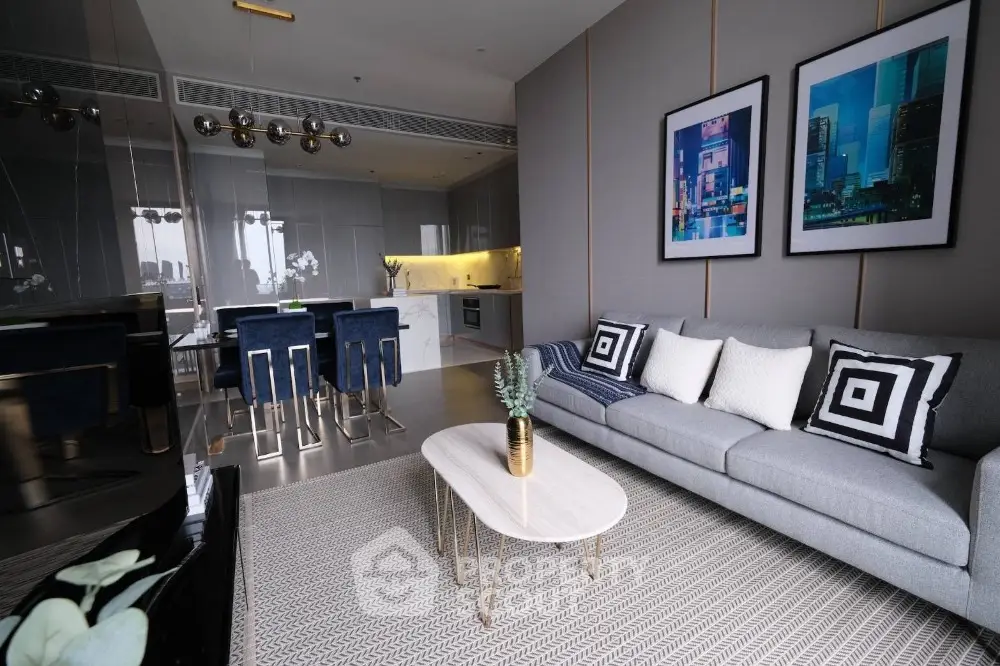 Luxurious modern living room with sleek kitchen and stylish decor