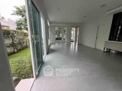 Spacious modern living room with garden view and sliding glass doors