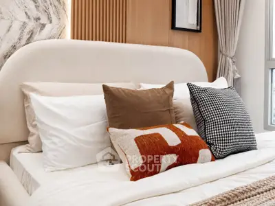 Luxurious bedroom with stylish pillows and elegant decor