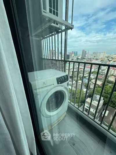High-rise balcony with city view and washing machine setup.