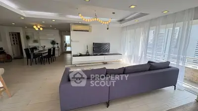 Spacious modern living room with elegant decor and large windows