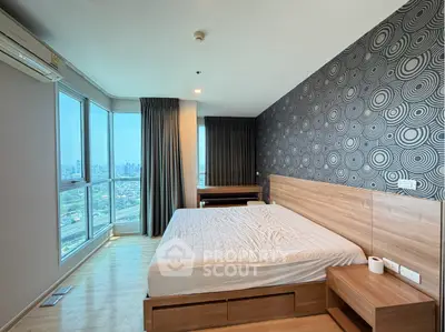 Modern bedroom with city view and stylish wallpaper in high-rise apartment