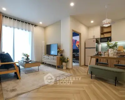 Modern open-layout living room with stylish decor and natural light