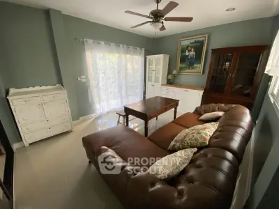 Charming living room with vintage furniture and natural light, perfect for cozy gatherings.