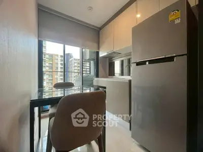 Modern kitchen with sleek appliances and city view, perfect for urban living.
