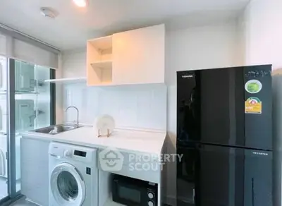Modern kitchen with sleek appliances and ample storage space