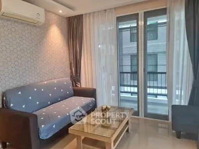 Cozy living room with modern decor and balcony access