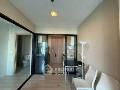 Modern apartment interior with glass partition and sleek furnishings