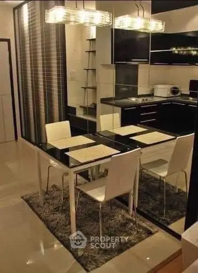 Modern kitchen with sleek black cabinets and stylish dining area